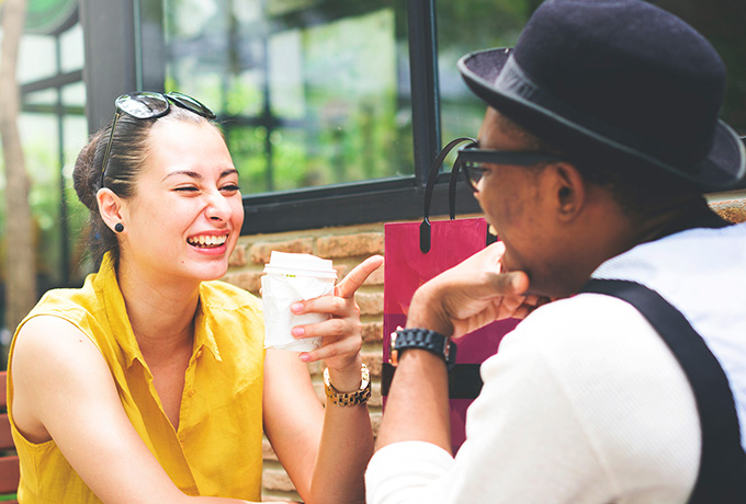 Couple sitting laughing - great communication skills