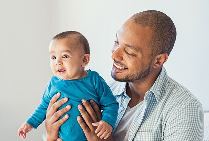 First time dad holding a newborn baby