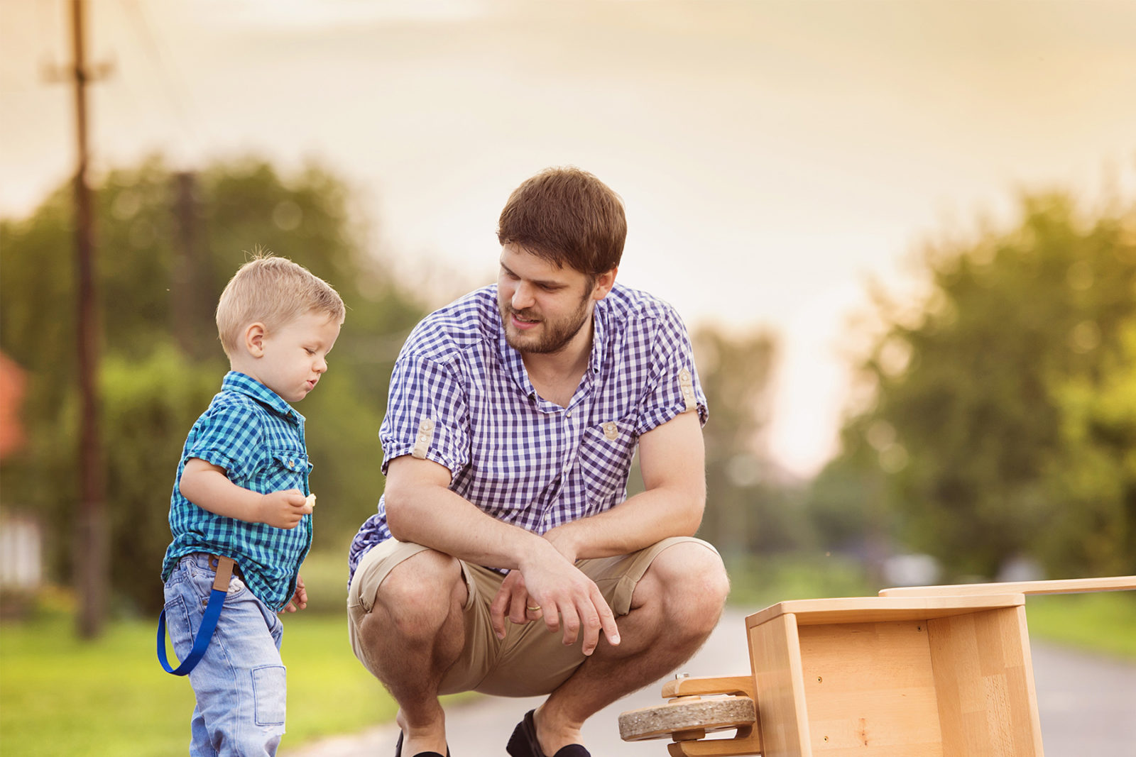 Separated father and child playing in the street