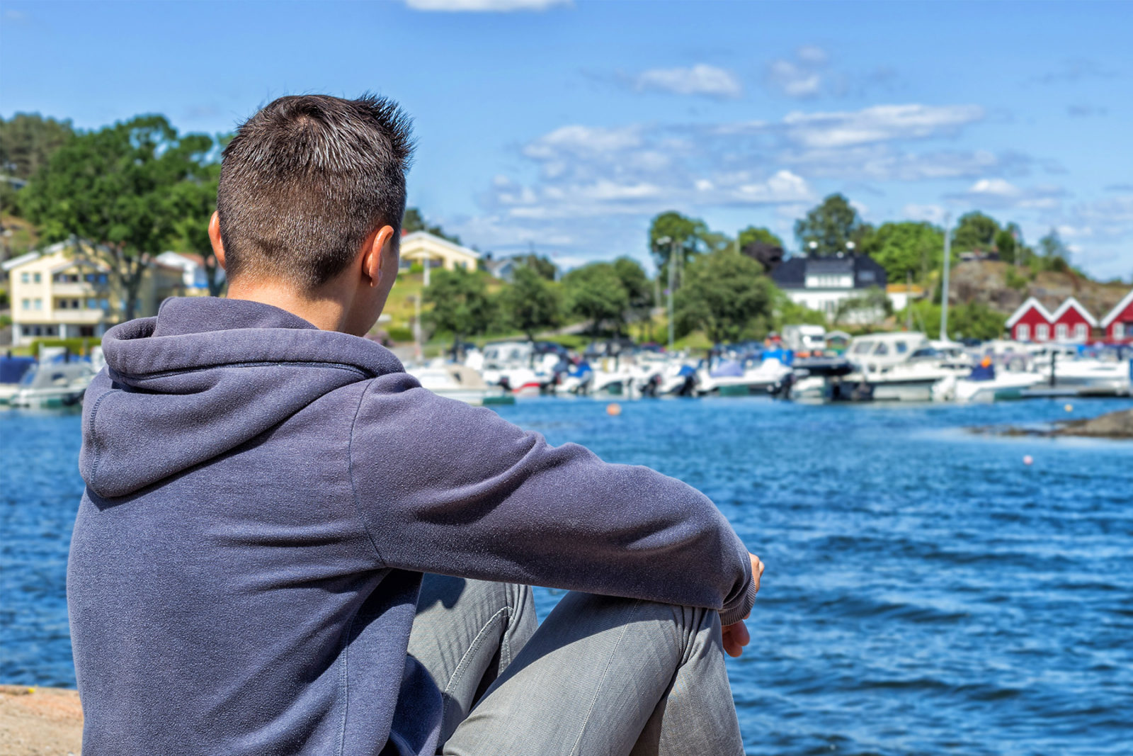 Man sat looking out to sea after a relationship separation