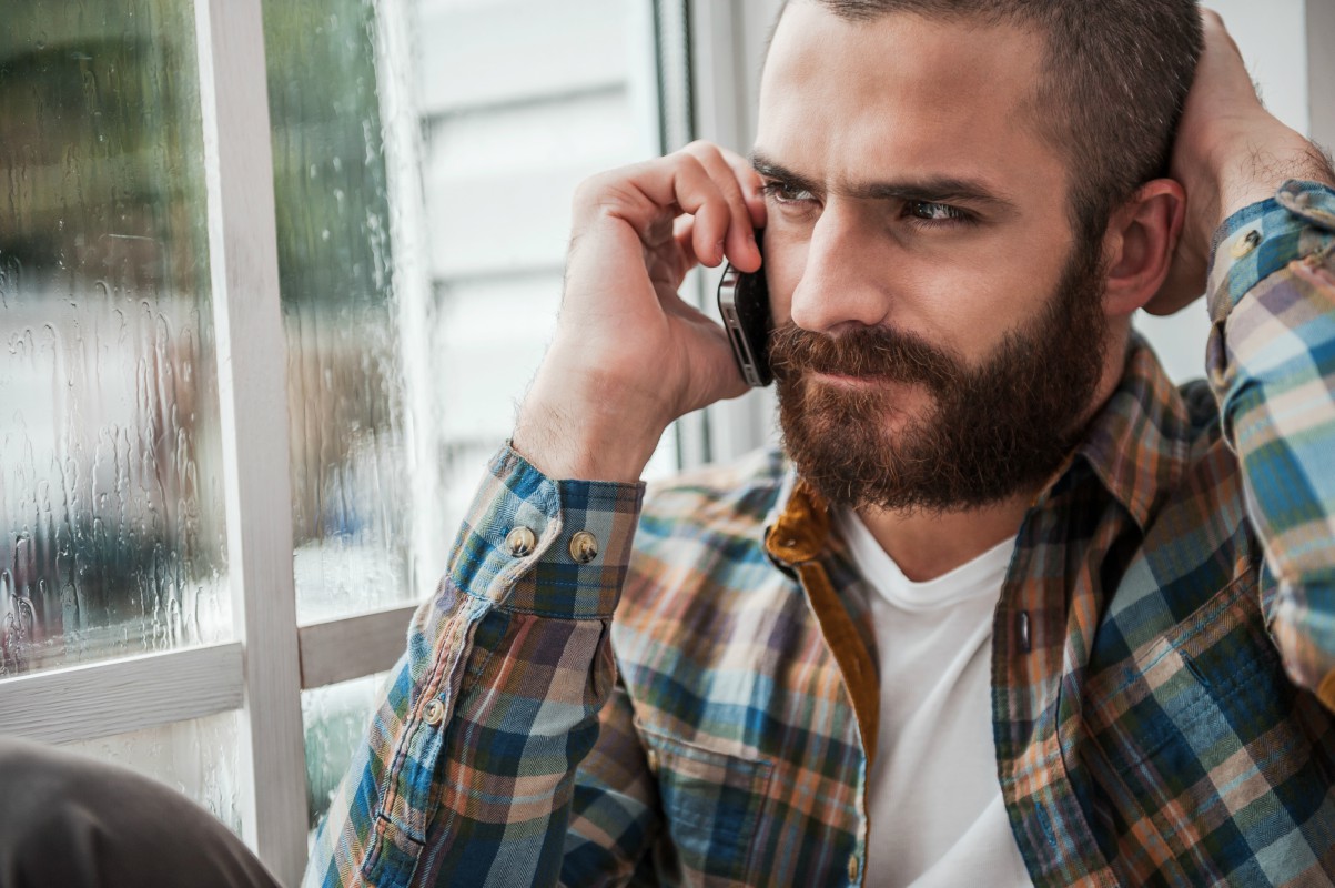 Man on phone getting help for Post-Traumatic Stress Disorder (PTSD)