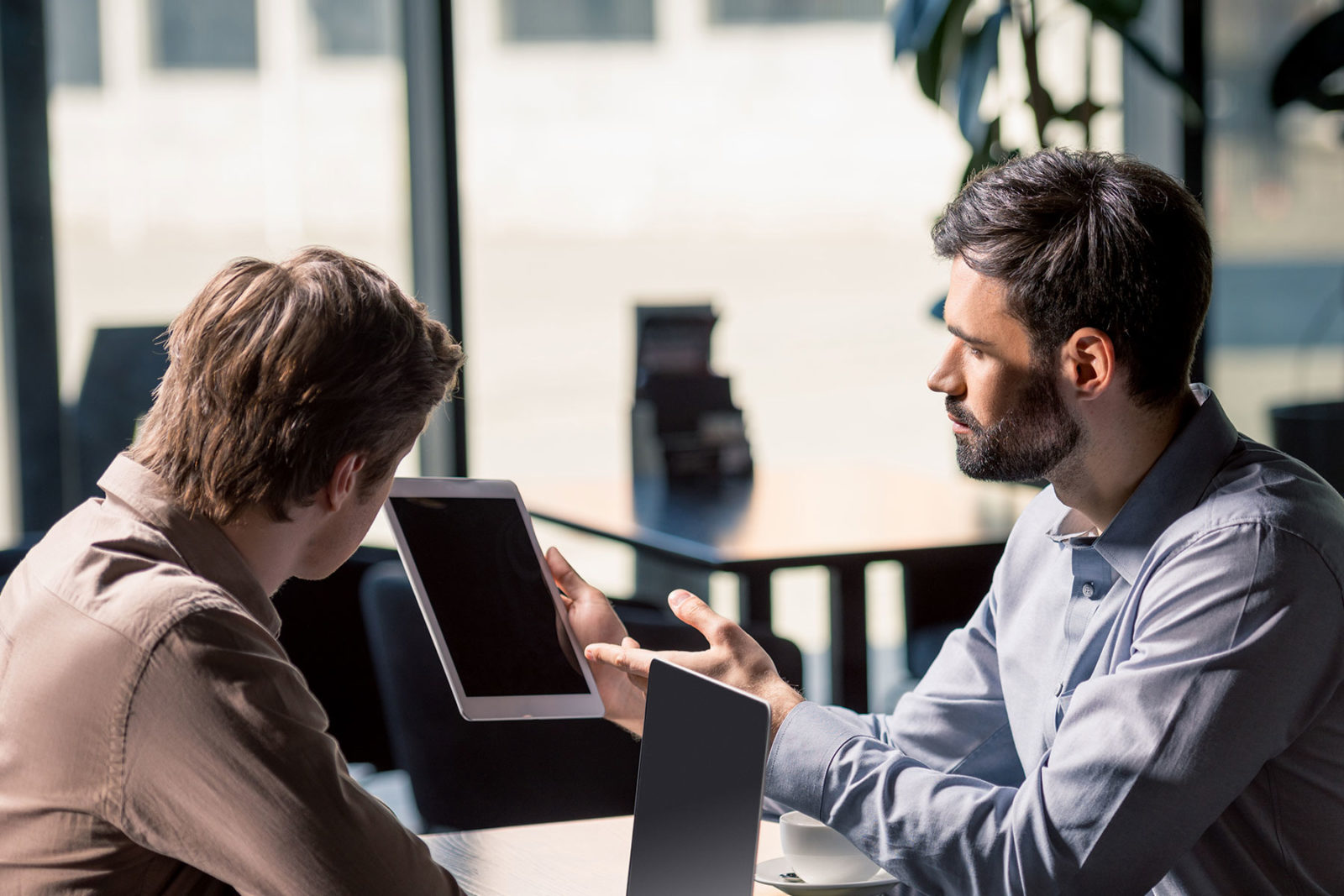 Decision making principles - two men discussing work