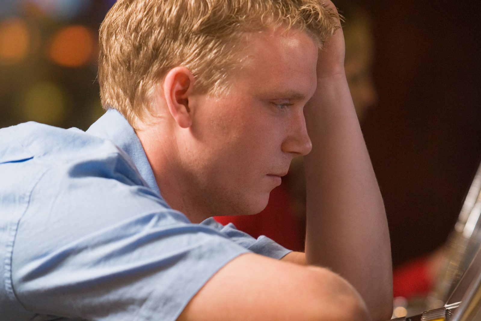 Man at pokies with gambling addiction