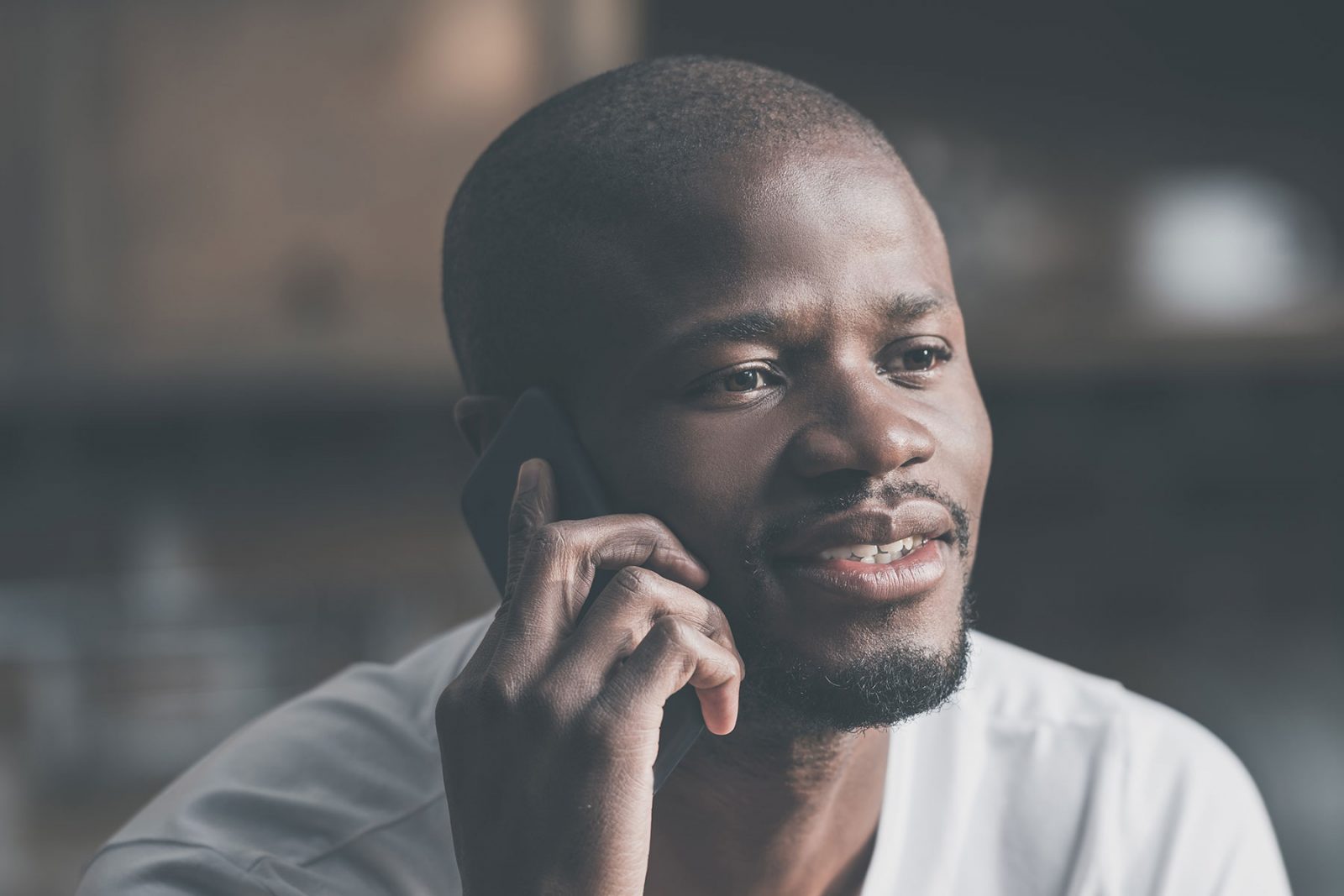 Man calling MensLine Australia talking on the phone