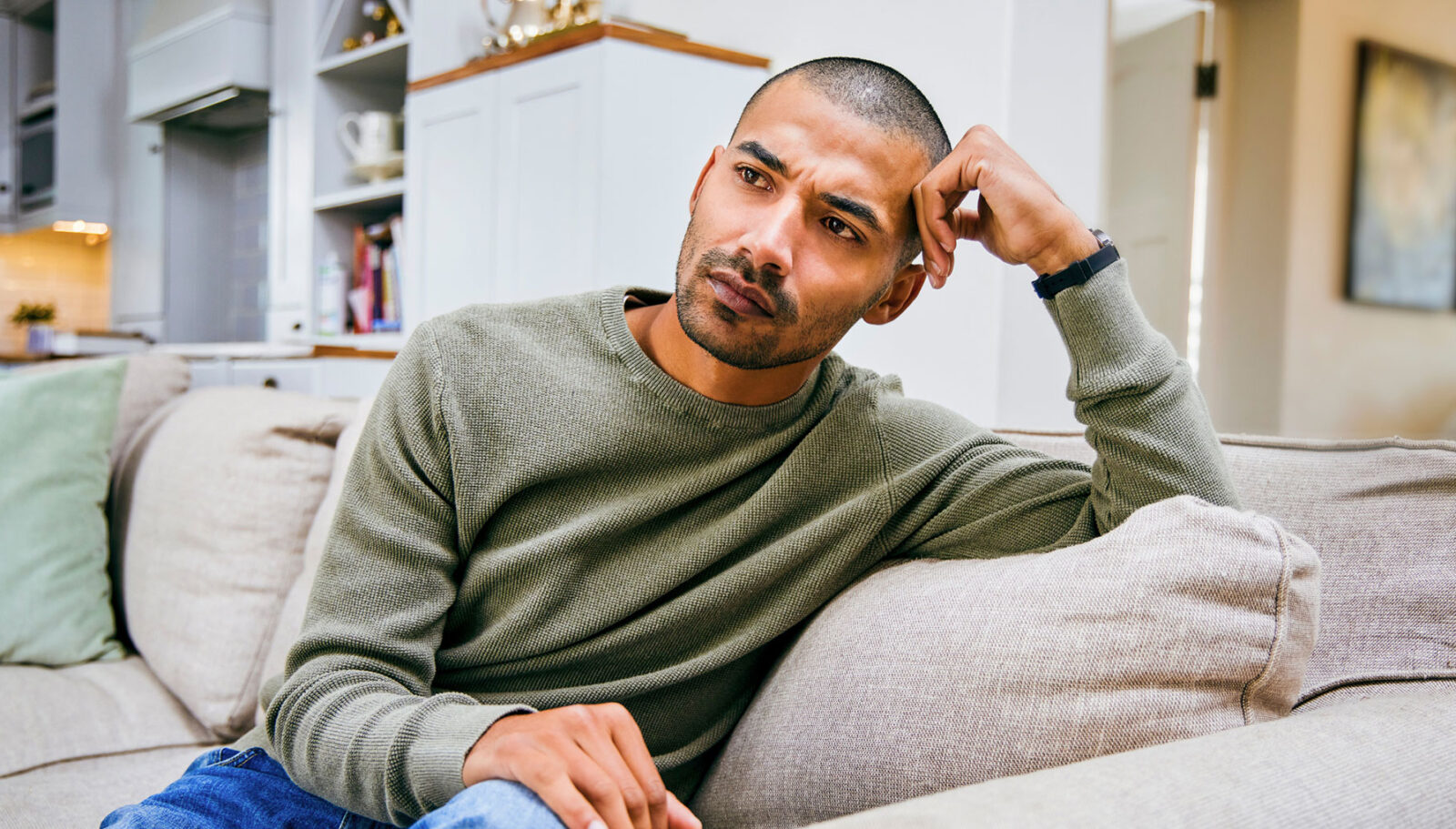 What is depression? Sad man sitting on couch